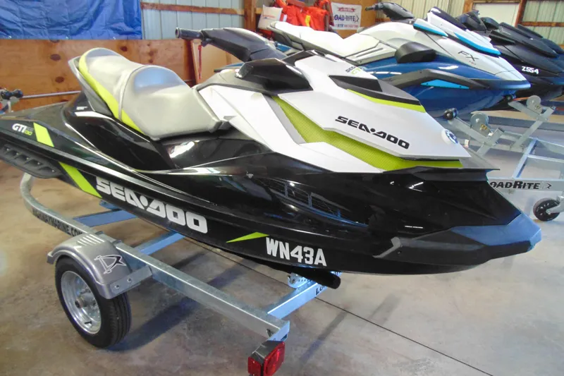 The Image of 2016 Sea-Doo GTI SE 130 jet ski on trailer in storage facility. - 2