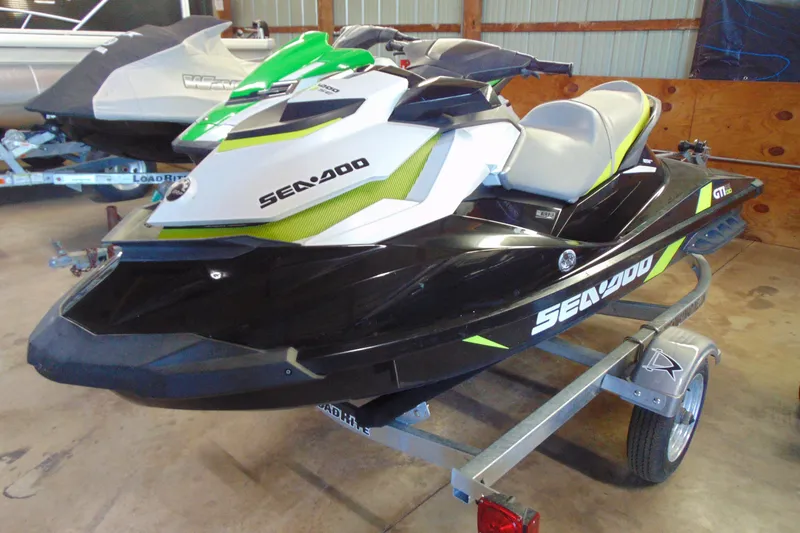 Slide: The Image of 2016 Sea-Doo GTI SE 130 jet ski on trailer in garage setting. - 5