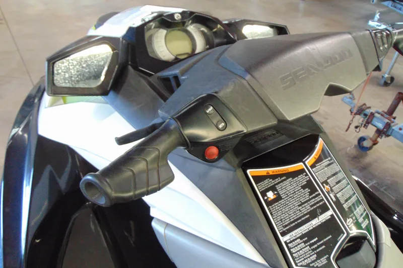 Slide: The Image of 2016 Sea-Doo GTI SE 130 handlebars and dashboard close-up in a showroom setting. - 7