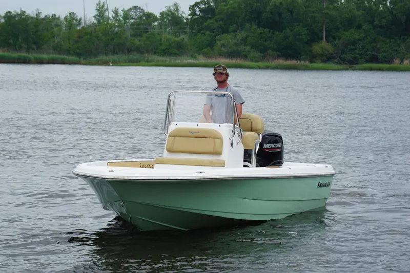 Slide: The Image of 2025 Savannah 190 IS boat on water with driver, featuring Mercury engine. - 3