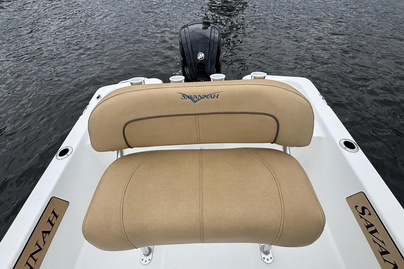 Slide: The Image of Savannah 190 IS 2025 boat with tan seating, on water. - 9