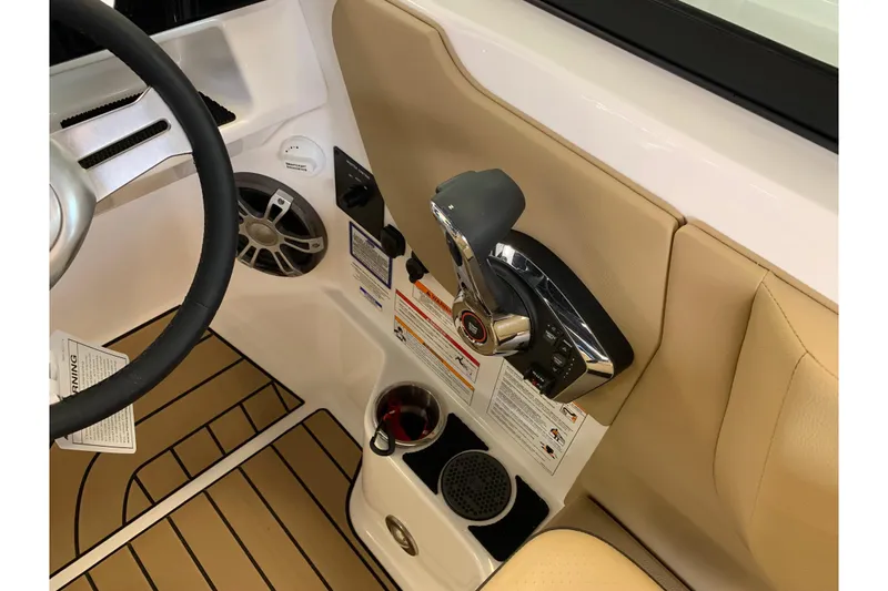 Slide: The Image of 2025 Sea Ray SDX 270 boat interior with steering wheel and control panel. - 10