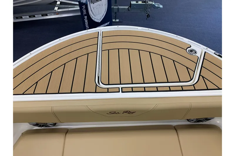 Slide: The Image of Sea Ray SDX 270 2025 boat rear with teak-style decking. - 21