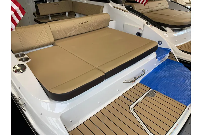 Slide: The Image of 2025 Sea Ray SDX 270 boat with tan seating and teak-style flooring. - 3