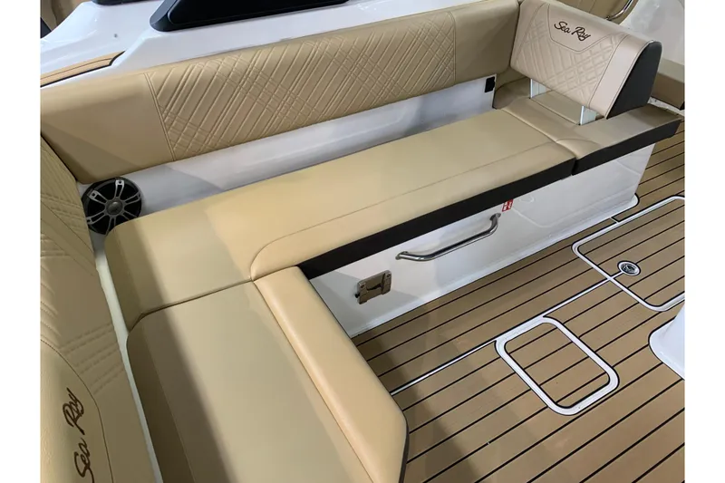 Slide: The Image of Luxurious seating on 2025 Sea Ray SDX 270 boat with tan upholstery and teak flooring. - 7