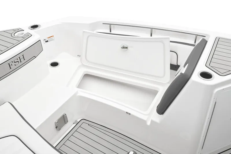 Slide: The Image of 2026 Yamaha Boats 252 FSH Sport interior with open storage compartment and seating. - 7
