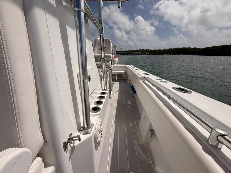Slide: The Image of Interior view of a 2001 Contender 27 Tournament boat on the water. - 12