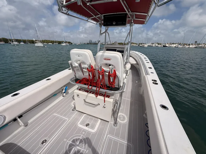 Slide: The Image of Contender 27 Tournament boat from 2001 on calm waters. - 17