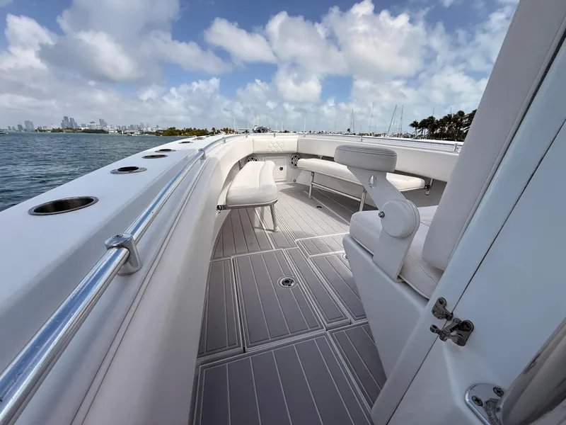 Slide: The Image of Contender 27 Tournament boat, 2001, on open water with city skyline. - 27