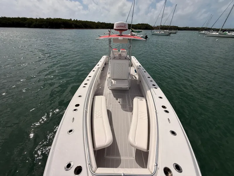 Slide: The Image of Contender 27 Tournament boat from 2001 on calm waters. - 28