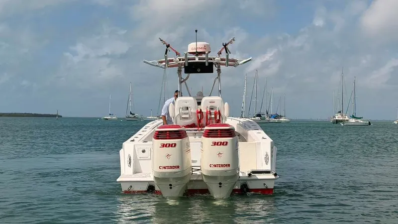 Slide: The Image of Contender 27 Tournament boat from 2001 on the water. - 4