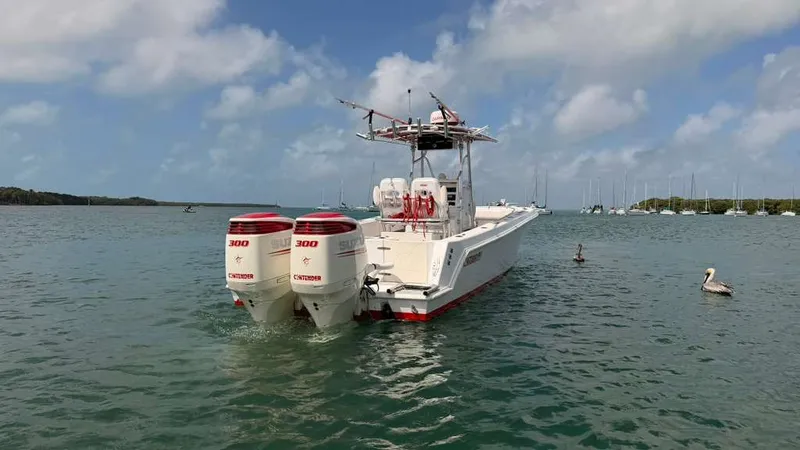 Slide: The Image of 2001 Contender 27 Tournament boat on calm waters. - 5