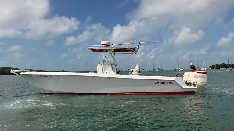 Slide: The Image of 2001 Contender 27 Tournament boat on calm water. - 6