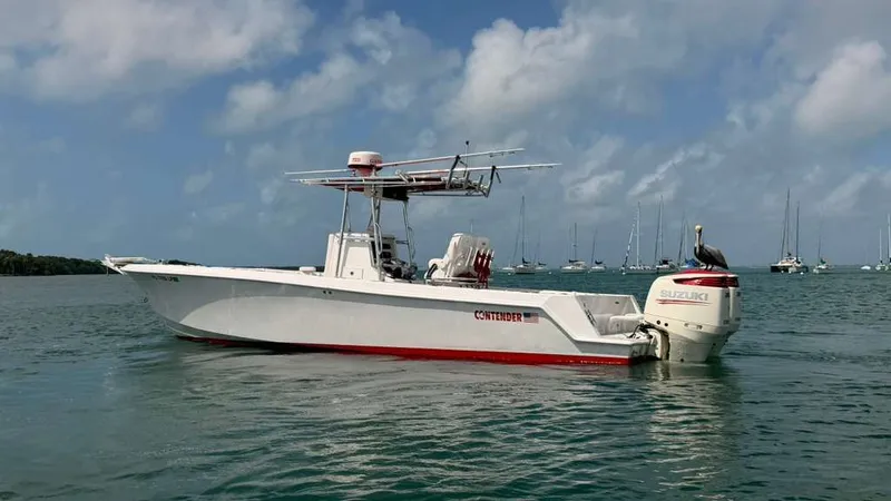Slide: The Image of Contender 27 Tournament boat from 2001 on calm waters. - 7