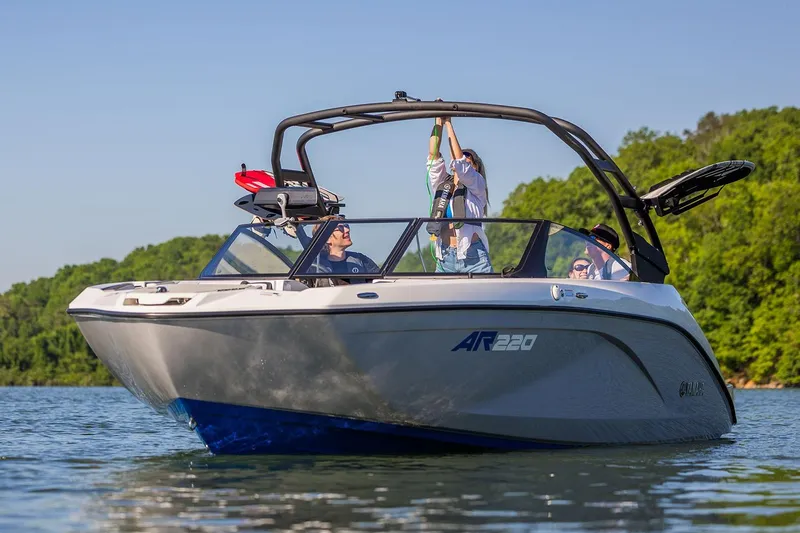Slide: The Image of Manufacturer Provided Image: 2026 Yamaha Boats AR220 on a lake, surrounded by lush greenery. - 13