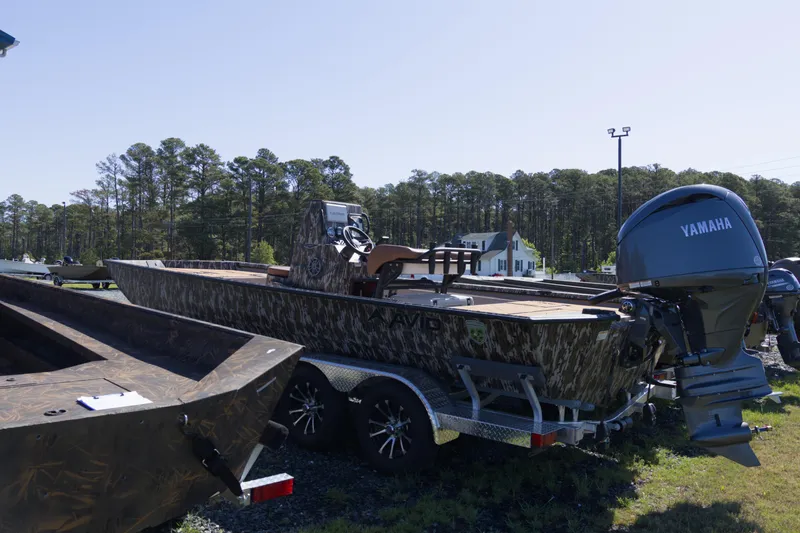 The Image of 2026 Avid 20 Rogue CC boat with Yamaha engine on trailer, outdoors. - 1