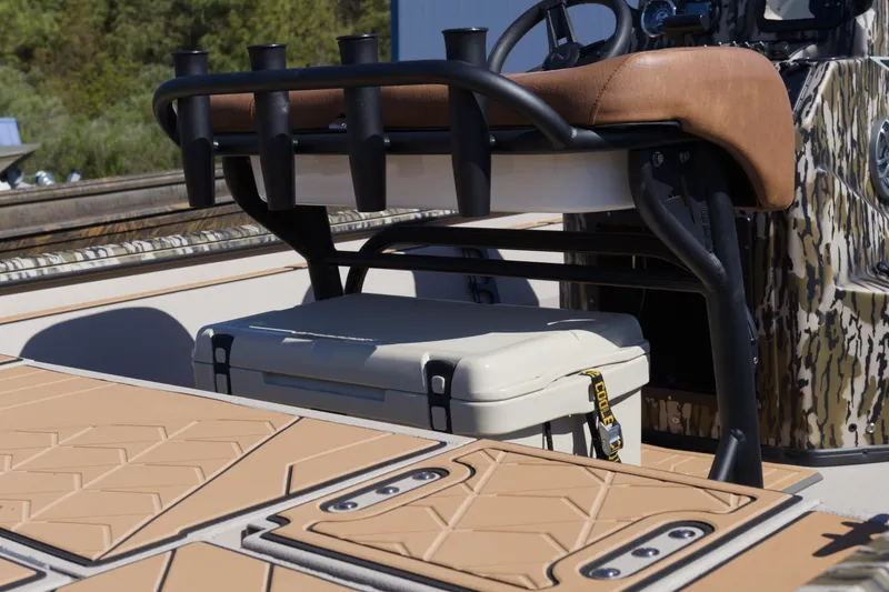 Slide: The Image of 2026 Avid 20 Rogue CC boat interior with seating and storage cooler. - 6