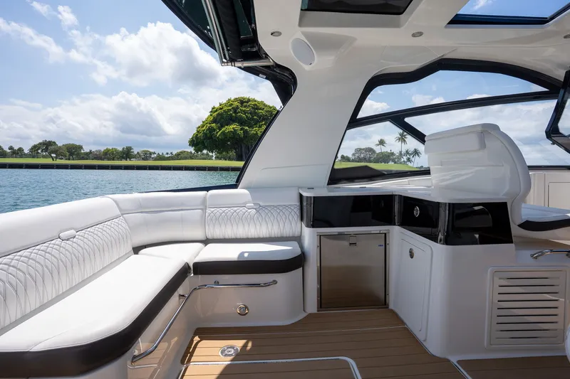 Slide: The Image of 2022 Sea Ray Sundancer 370 Outboard cruising swiftly on the water. - 1