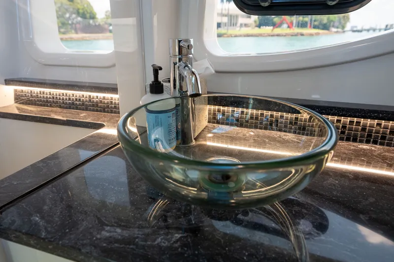 Slide: The Image of Interior of 2022 Sea Ray Sundancer 370 Outboard with luxurious white seating. - 7