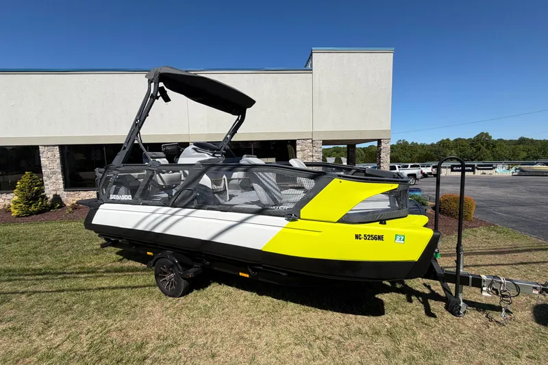 Slide: The Image of 2024 Sea-Doo Switch Sport 21 on display, featuring vibrant yellow and black design. - 2