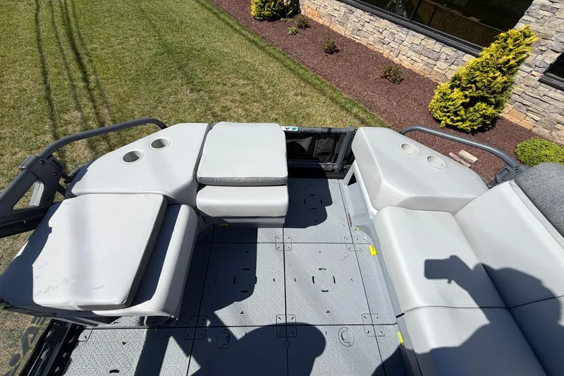 Slide: The Image of 2024 Sea-Doo Switch Sport 21 interior seating with cup holders, showcasing spacious layout. - 4