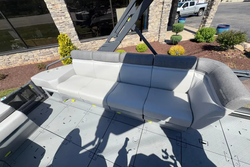 Slide: The Image of 2024 Sea-Doo Switch Sport 21 boat interior with gray seating and modern design. - 8
