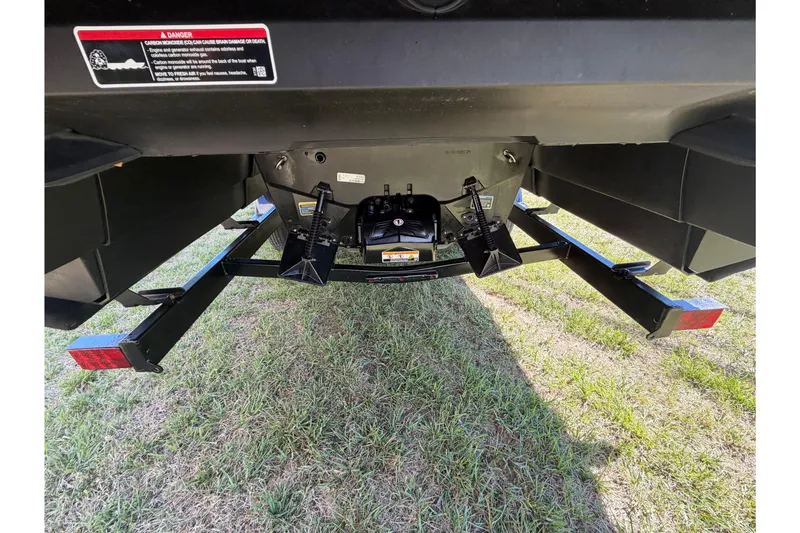 Slide: The Image of Rear view of 2024 Sea-Doo Switch Sport 21 trailer hitch on grass. - 9