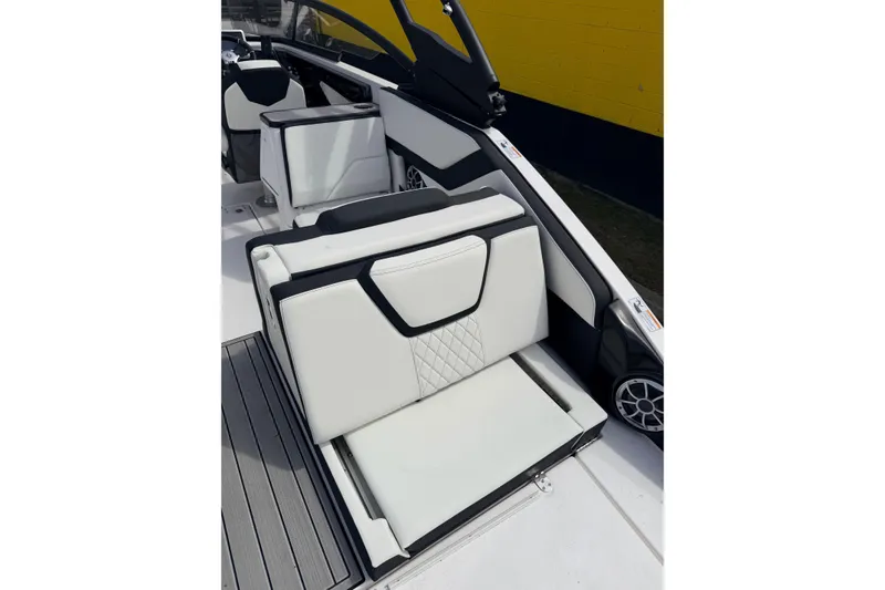 Slide: The Image of 2026 Yamaha Boats 252S interior with white and black seating, modern design. - 11