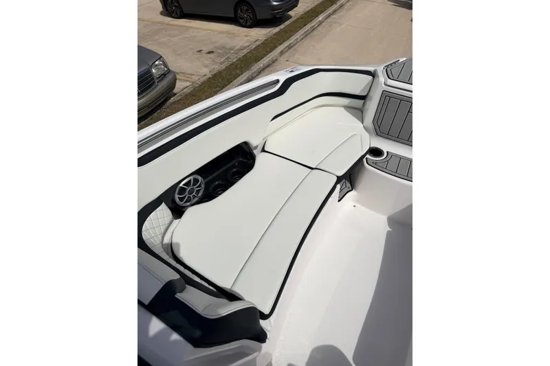Slide: The Image of 2026 Yamaha Boats 252S interior seating with speaker and cup holder. - 12