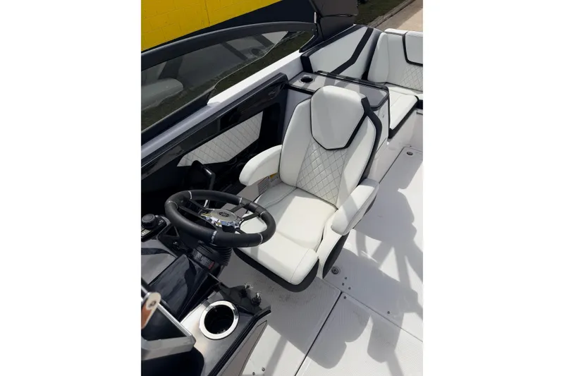 Slide: The Image of 2026 Yamaha Boats 252S interior with white seating and steering wheel. - 14