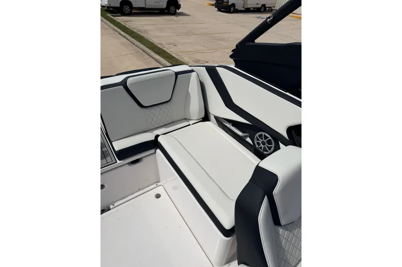 Slide: The Image of 2026 Yamaha Boats 252S interior seating with modern design and speaker detail. - 16