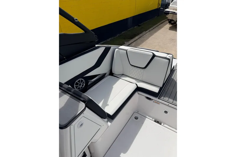Slide: The Image of 2026 Yamaha Boats 252S interior seating with sleek white and black design. - 17