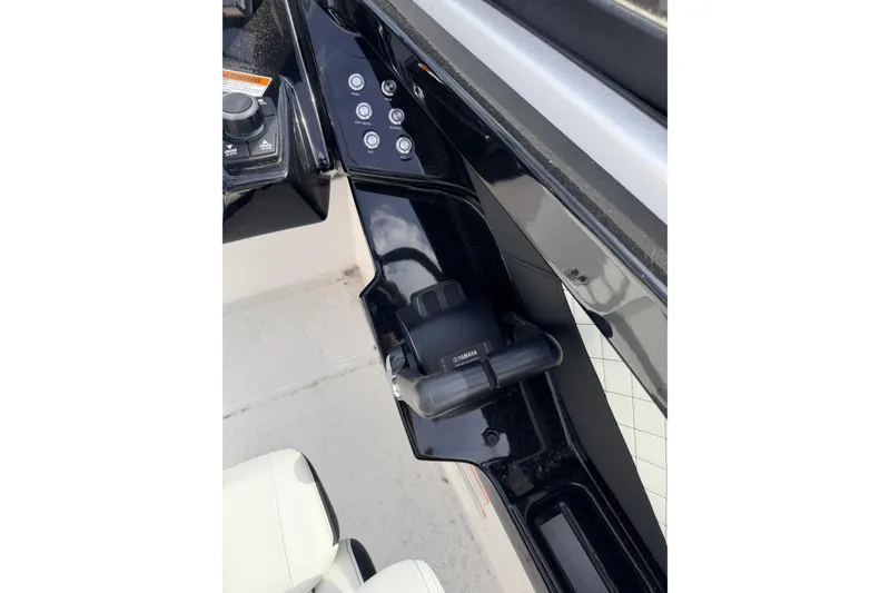 Slide: The Image of Control panel of 2026 Yamaha Boats 252S, featuring sleek black design and modern controls. - 19