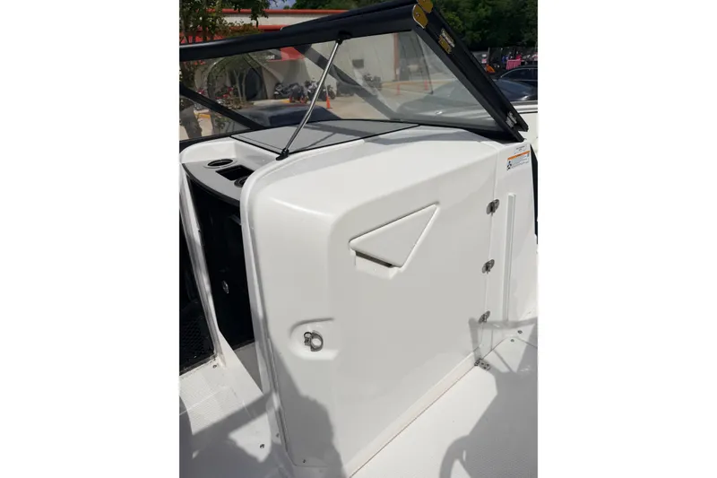 Slide: The Image of 2026 Yamaha Boats 252S interior detail, featuring sleek white paneling and modern design elements. - 21
