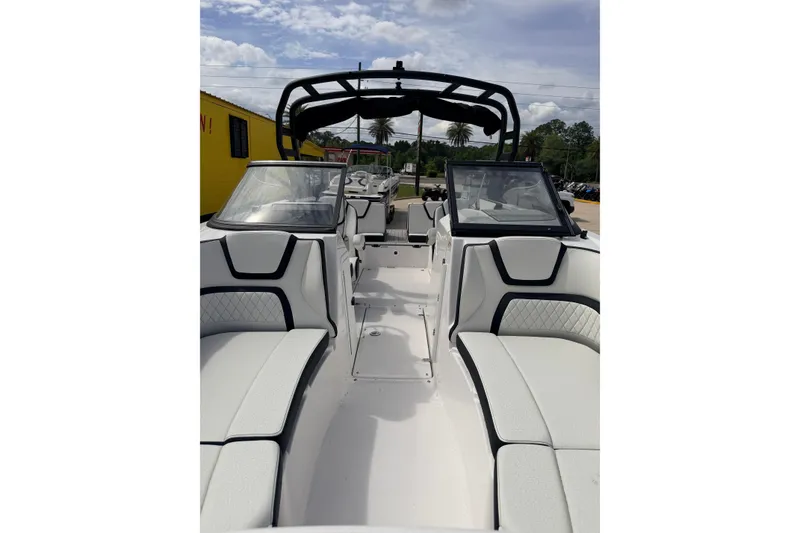 Slide: The Image of 2026 Yamaha Boats 252S interior with sleek white seating and modern design. - 7