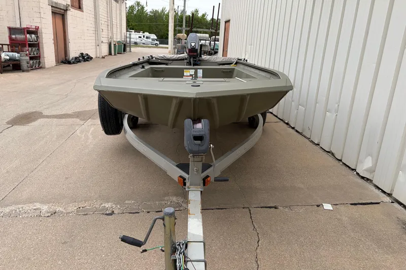 Slide: The Image of 2024 TRACKER MARINE Grizzly 1754 boat on trailer, parked outdoors. - 4
