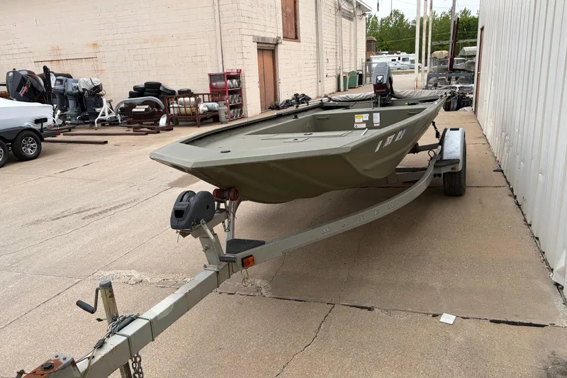 Slide: The Image of 2024 TRACKER MARINE Grizzly 1754 boat on trailer in outdoor storage area. - 6