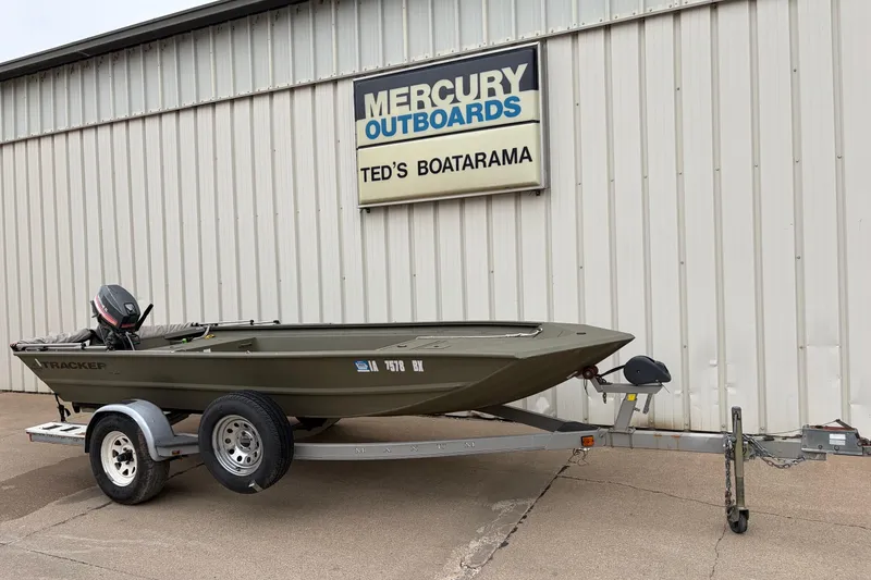 The Image of 2024 TRACKER MARINE Grizzly 1754 boat on trailer outside Mercury Outboards dealership. - 0
