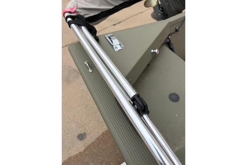 Slide: The Image of 2024 Tracker Marine Grizzly 1754 boat detail with metal railing and fasteners. - 12