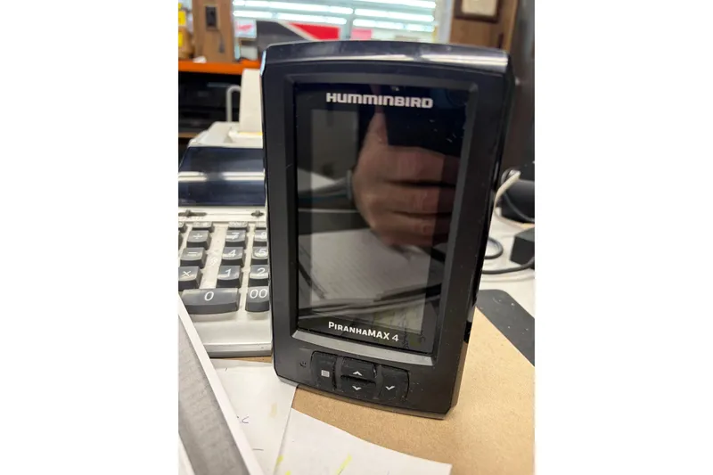Slide: The Image of Humminbird PiranhaMAX 4 fish finder on desk, 2024 Bass Tracker Super Guide. - 14