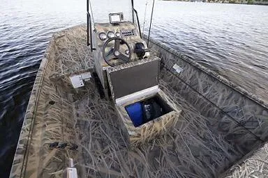 Slide: The Image of Manufacturer Provided Image: 2026 Crestliner 1870 Retriever FCC boat with camo design on a lake. - 7