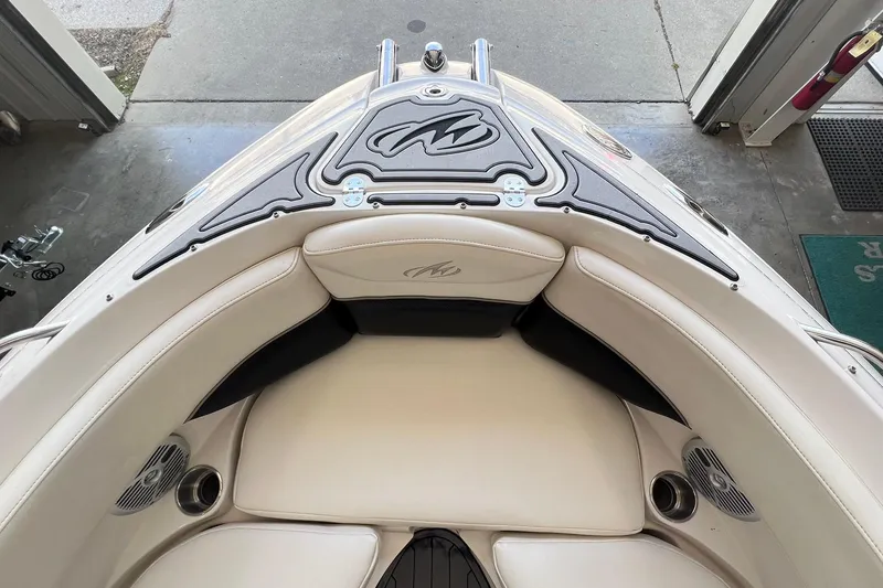 Slide: The Image of 2007 Monterey 248LS Montura Bowrider interior with cushioned seating and sleek design. - 11