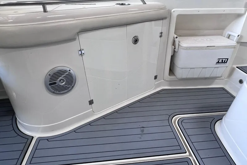 Slide: The Image of 2007 Monterey 248LS Montura Bowrider interior with Yeti cooler and marine speaker. - 20