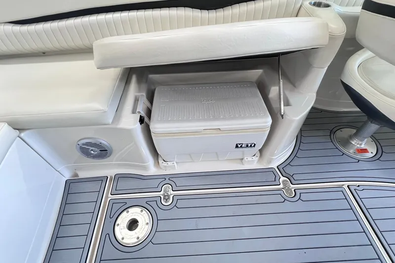 Slide: The Image of 2007 Monterey 248LS Montura Bowrider interior with Yeti cooler and cushioned seating. - 22