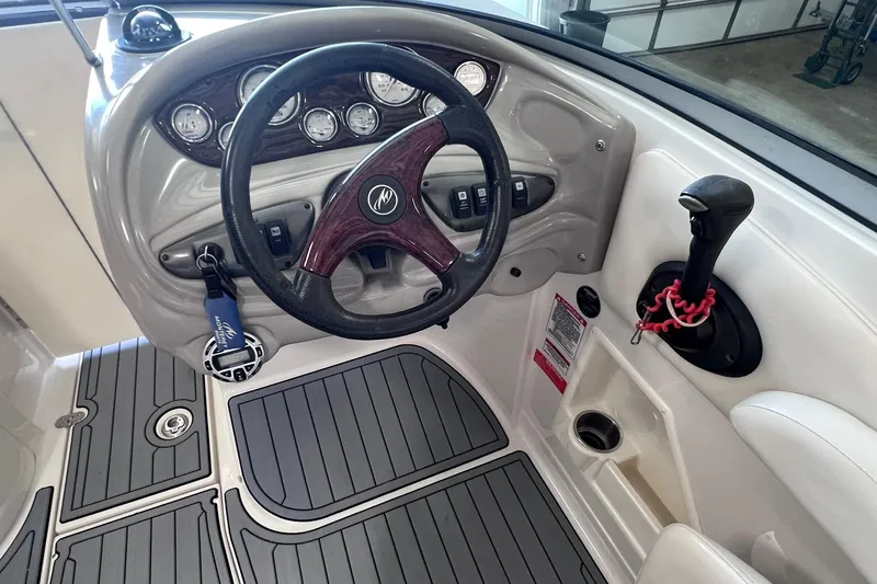 Slide: The Image of 2007 Monterey 248LS Montura Bowrider dashboard with steering wheel and controls. - 25