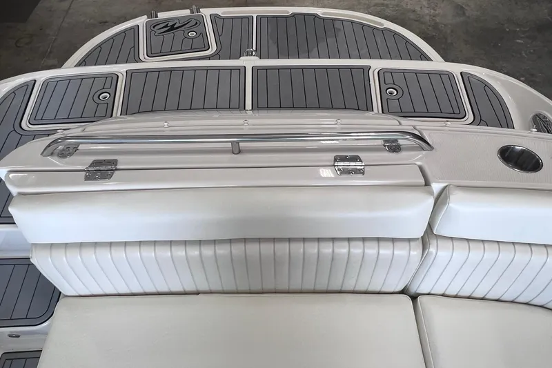 Slide: The Image of 2007 Monterey 248LS Montura Bowrider boat interior with cushioned seating and storage compartments. - 27