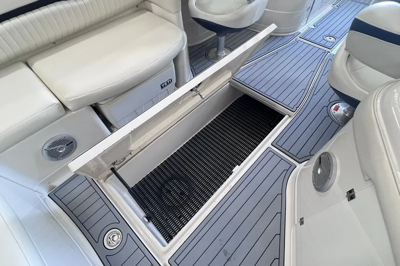 Slide: The Image of 2007 Monterey 248LS Montura Bowrider interior with open storage compartment and seating. - 31