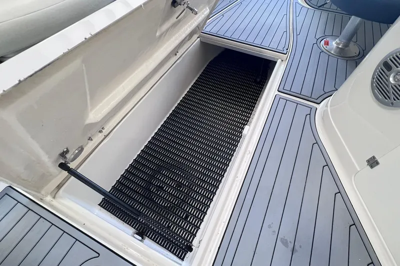 Slide: The Image of Open storage compartment on 2007 Monterey 248LS Montura Bowrider boat deck. - 32