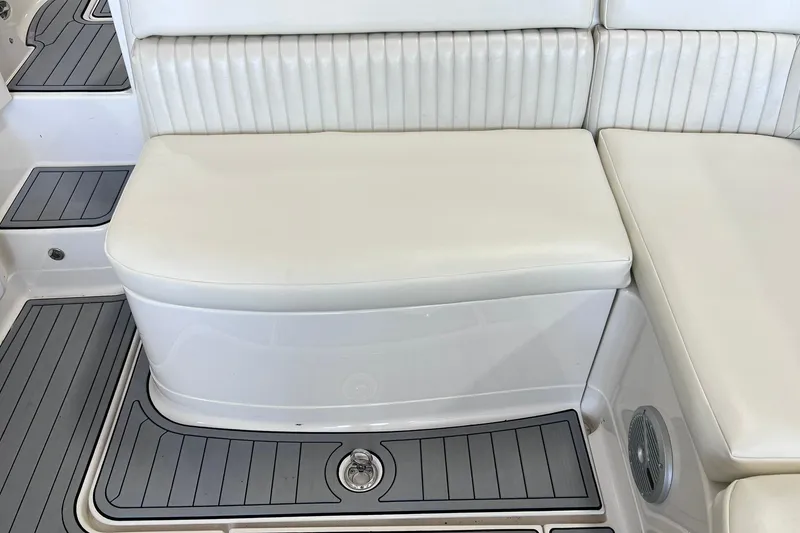 Slide: The Image of White seating on 2007 Monterey 248LS Montura Bowrider boat with gray flooring. - 33