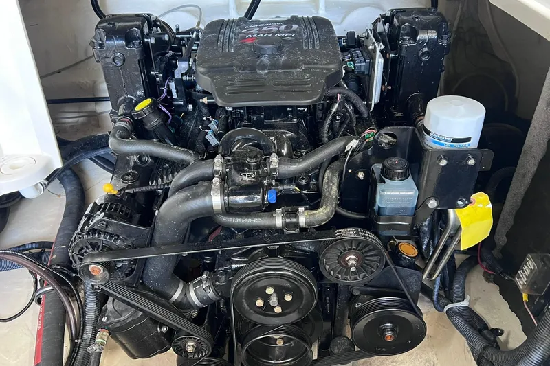 Slide: The Image of Engine of a 2007 Monterey 248LS Montura Bowrider boat, showcasing detailed components. - 34